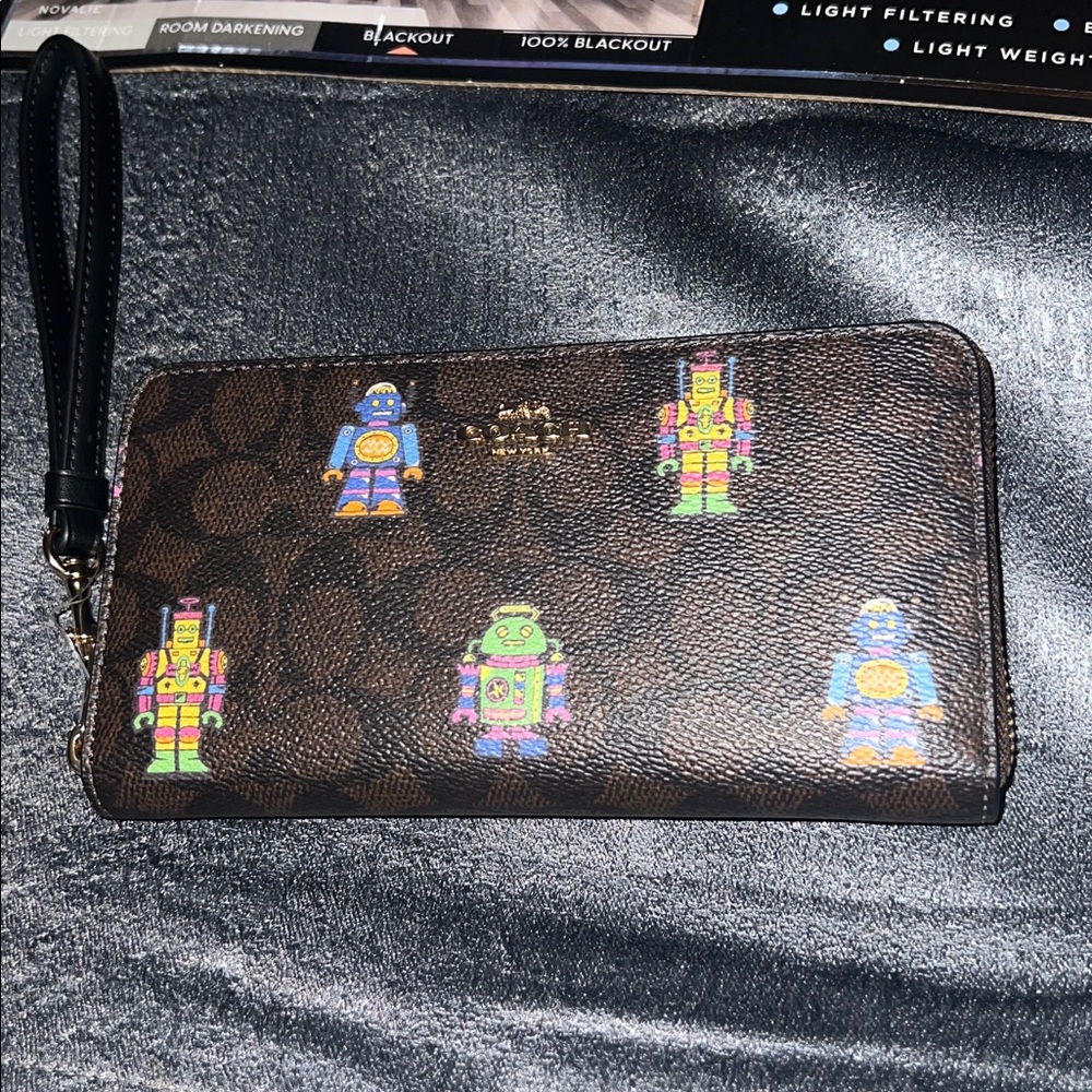 Coach cosmic long wallet with strap.